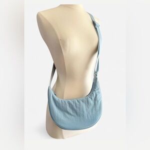 Light Blue Crescent Crossbody Bag by  Aritzia